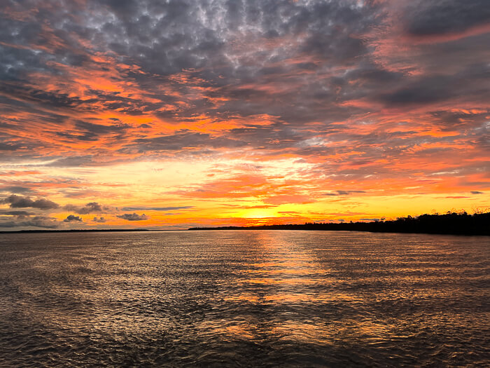 A colorful sunset on the Amazon River, viewed from a ferry sailing from Manaus to Santarem