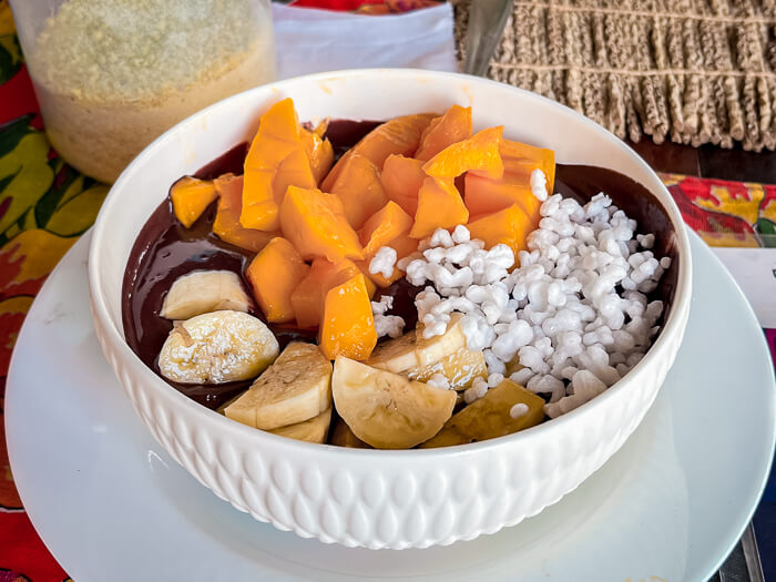 A white bowl full of açai and tropical fruits, a popular meal in the Amazon region