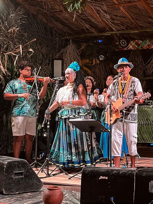 A Carimbo band performing on a stage 