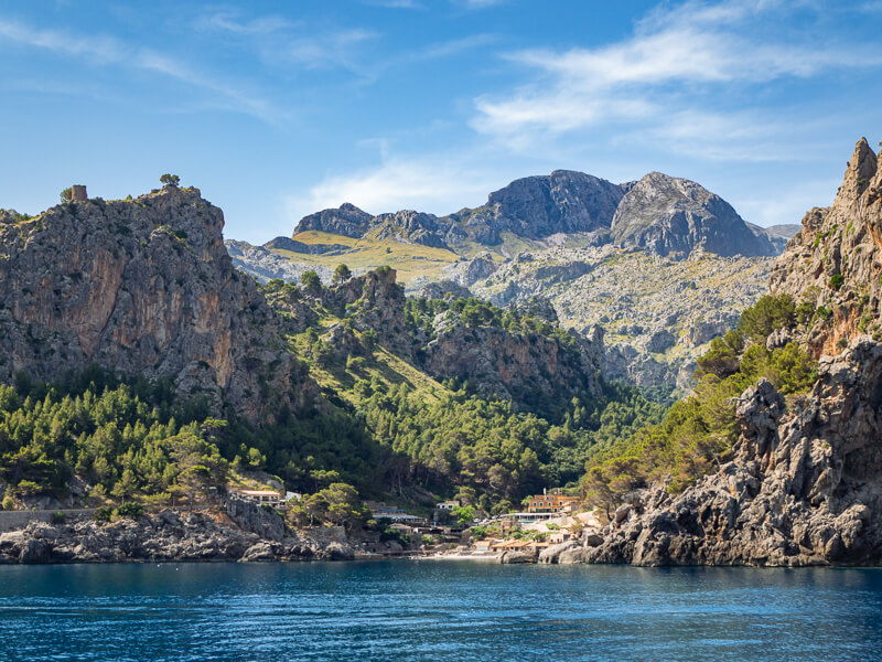 The village of Sa Calobra surrounded by the dramatic Tramuntana mountains, one of the best day trips from Soller.