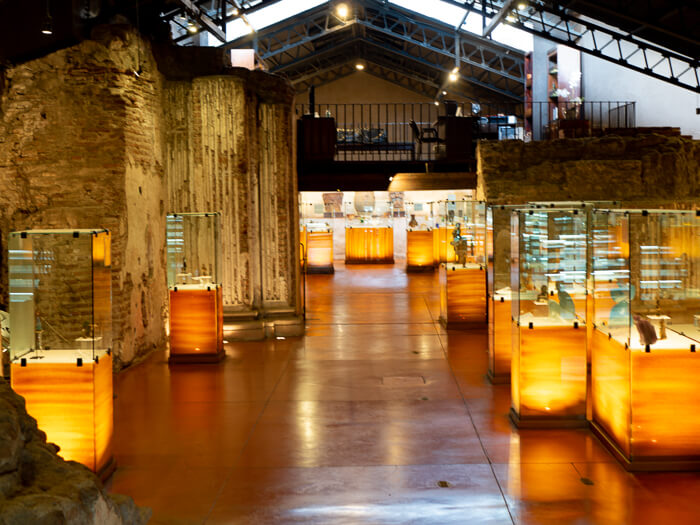 Exhibits displayed in glass boxes at one of the Casa Santo Domingo museums