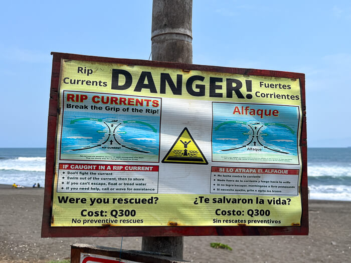 A sign warning swimmers of rip currents in El Paredon, Guatemala