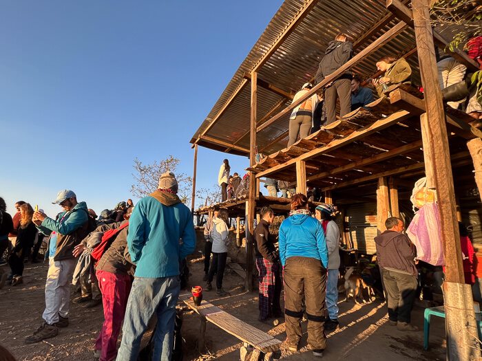 Crowds of hikers gathering at the Rostro Maya viewpoint at Lake Atitlan