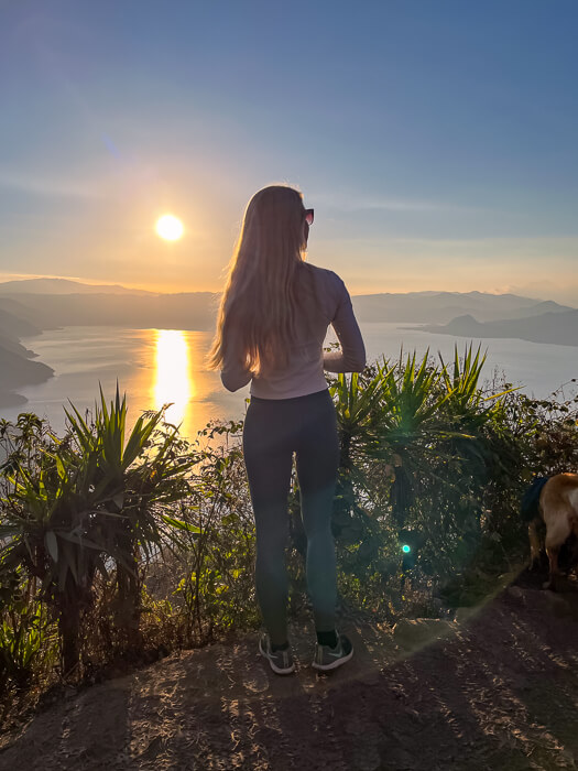 Me standing on the Indian Nose peak, gazing at the sunrise over Lake Atitlan