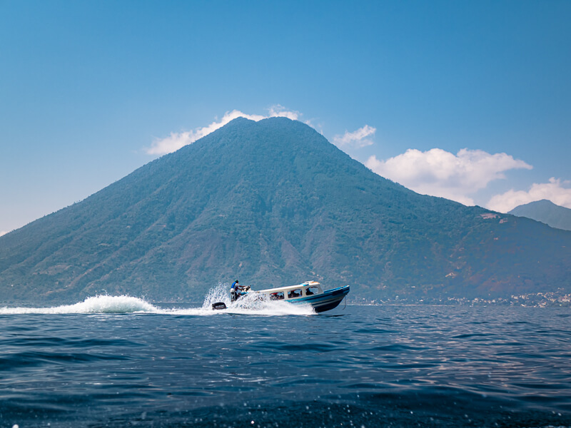 A wooden boat transporting passengers on Lake Atitlan