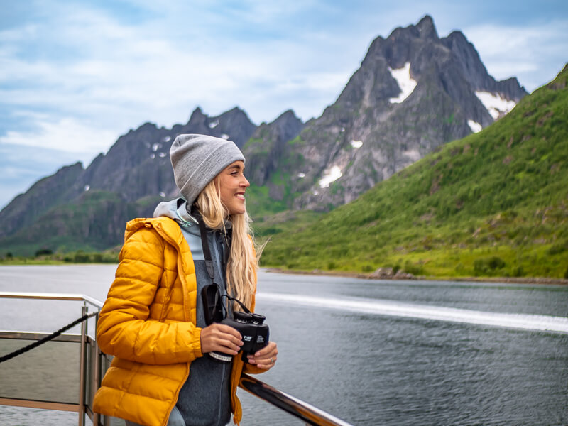 Me gazing at the mountainous landscapes on a Silent Trollfjord Cruise in Norway