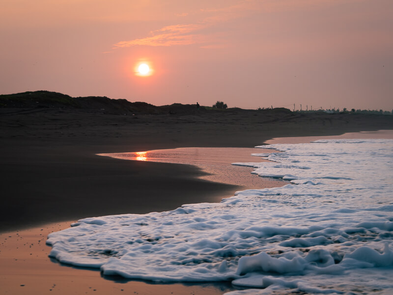 sun rising above the horizon at El Paredon Beach; the best place to round off your Guatemala 10-day itinerary