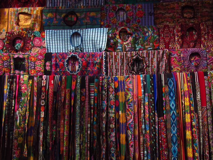 Brightly-colored scarves and traditional clothing sold at Chichicastenango market