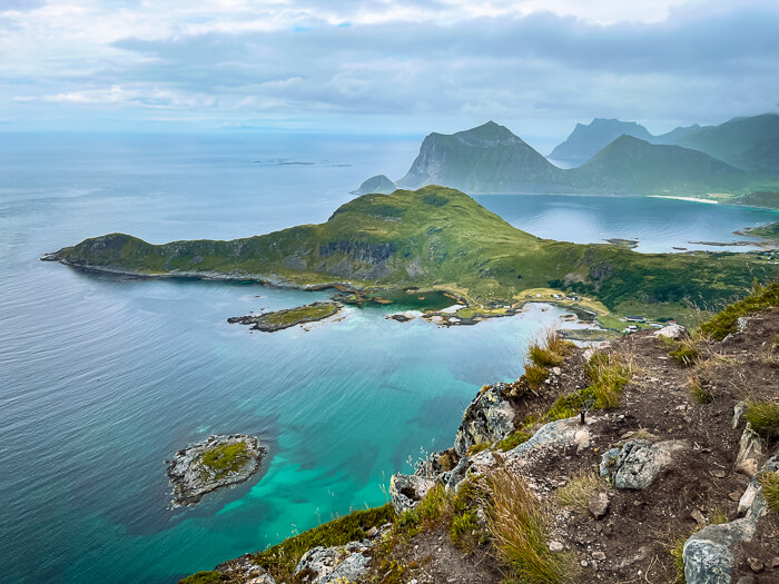 A view of green mountains along the coastline of Lofoten Islands viewed from Offersøykammen hike