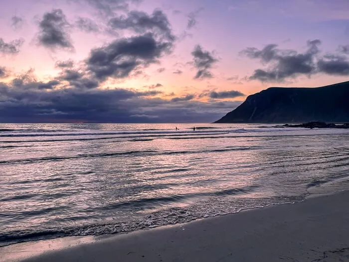 small waves and purple sky at Skagsanden Beach during Midnight Sun