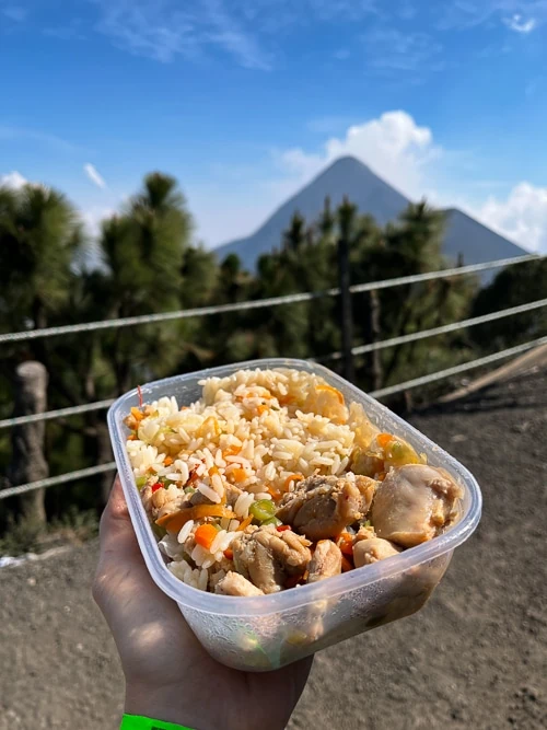 a plastic box with rice and chicken, a typical lunch on the Acatenango overnight trek