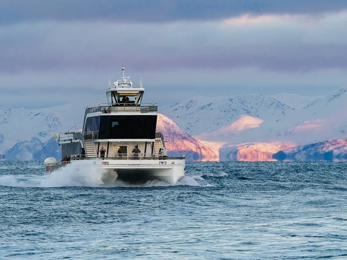Brim Explorer boat surrounded by views of snowy mountains