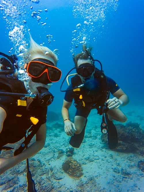 An underwater selfie of me and my fiancé scuba diving in Koh Tao.