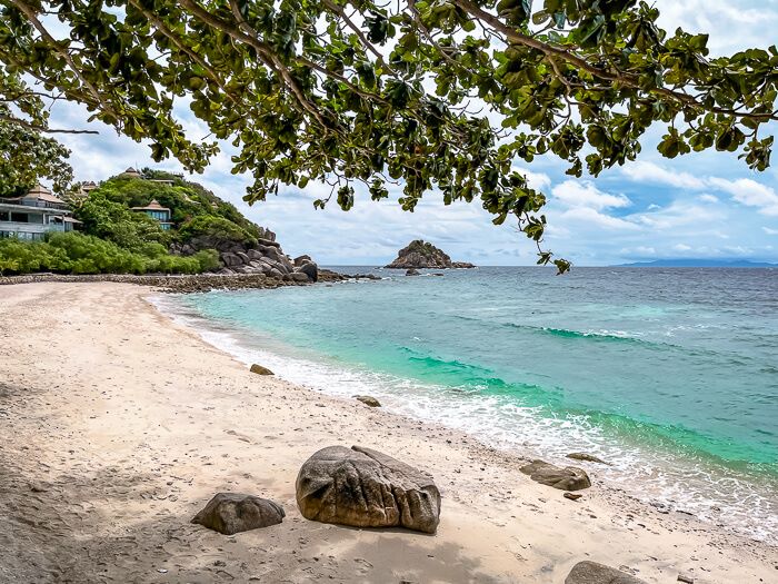 An empty stretch of sand and clear blue sea at the small Sai Daeng Beach.