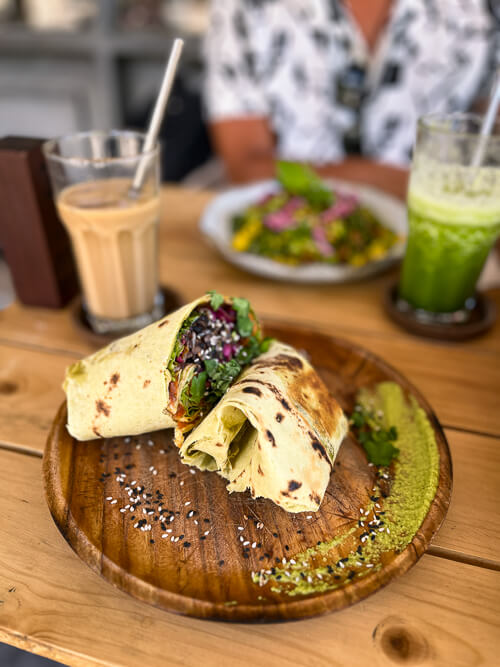 Smoothies and a wrap filled with vegetables at The Factory Cafe on Koh Tao.