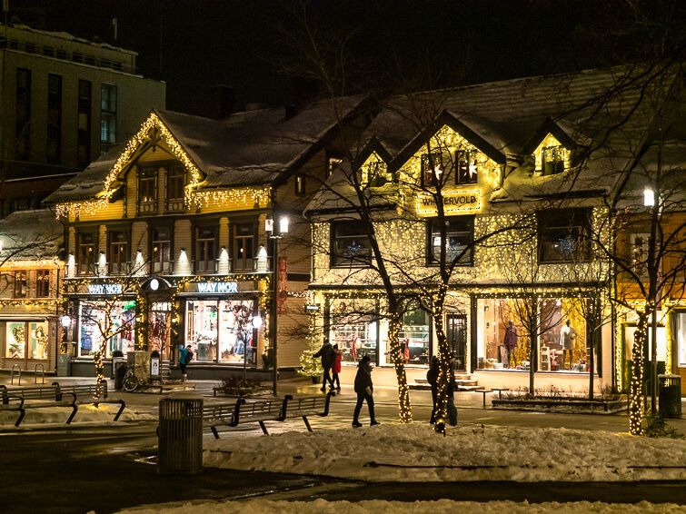 Wooden houses decorated with Christmas lights along Storgata, the main shopping street of Tromso.