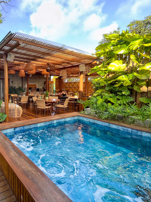 A small blue plunge pool at Vila Sal Noronha on a sunny day.