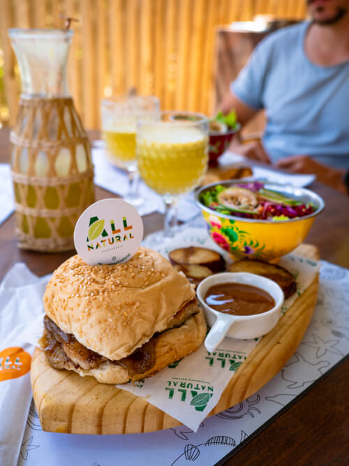 A fish burger served with potatoes and a salad at Noronha All Natural restaurant.