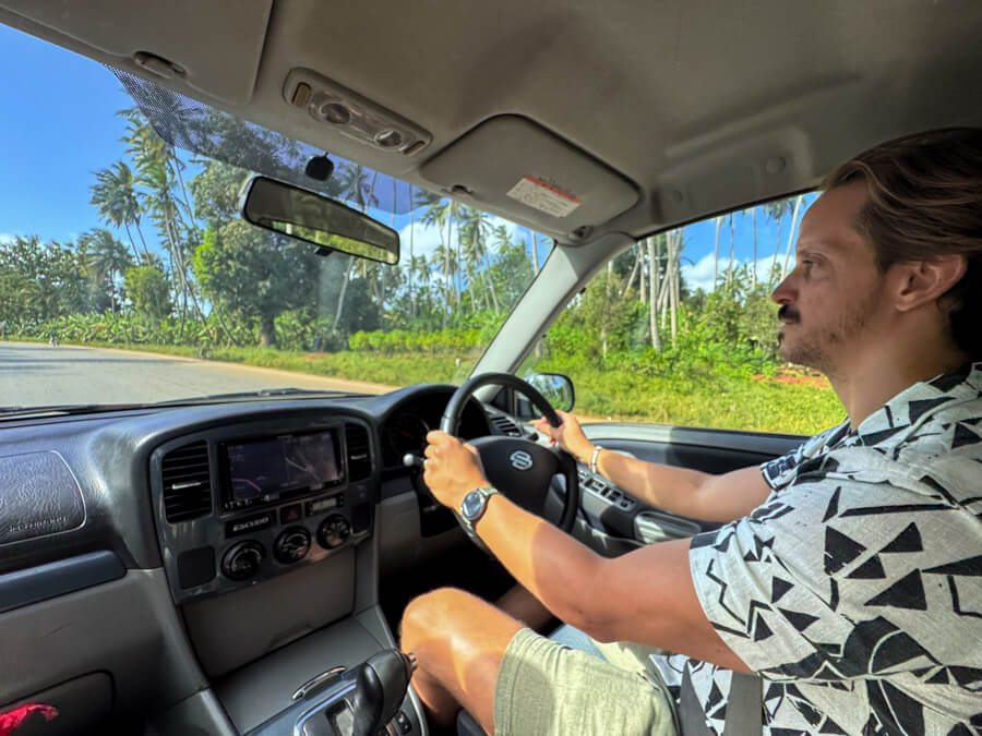 My husband driving our rental car in Zanzibar.