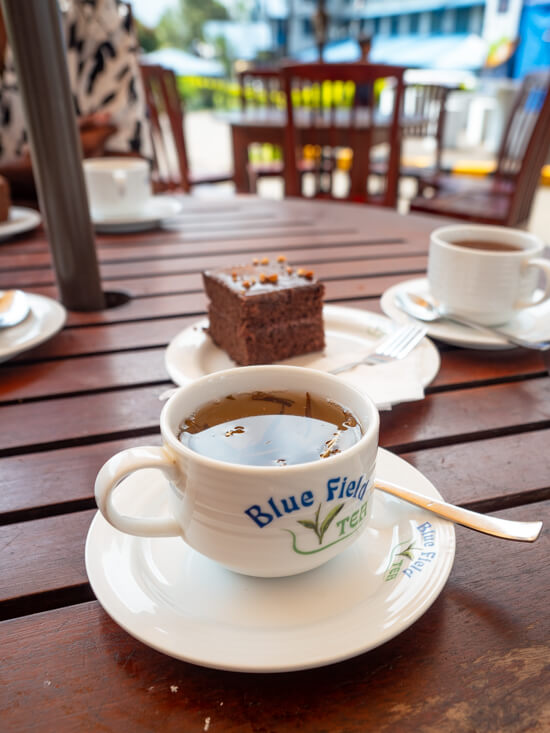 A cup of tea and a piece of cake that we had at Blue Field Tea Factory.