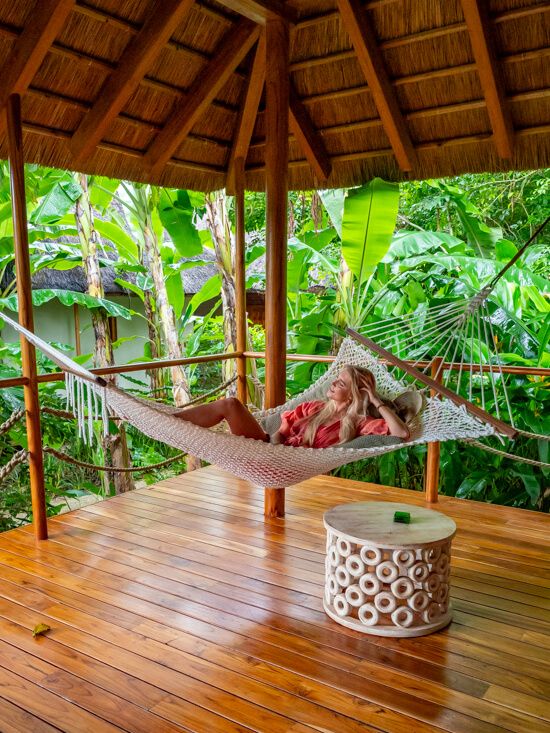 Me lying in a hammock at the porch of a bungalow at Zuri Zanzibar hotel.