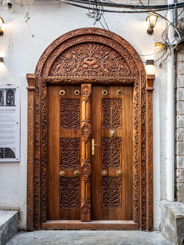 An intricately carved wooden door in Stone Town.